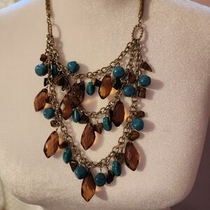 Loft necklace with brown and turquoise colored beads